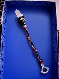 a wand is sitting in a blue box