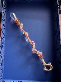 a blue box with a necklace and beads on it