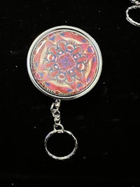 a key ring with a red and orange design