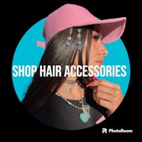 a woman wearing a pink hat with the words shop hair accessories