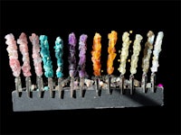 a hanukkah menorah with different colored stones