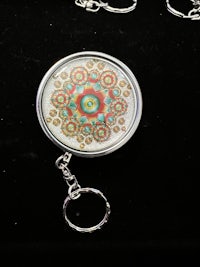 a key chain with a colorful design on it