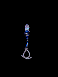 a blue glass bead on a black background