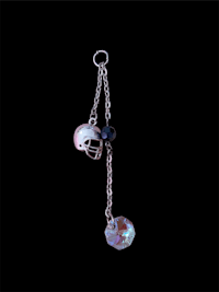 a necklace with a football helmet on it