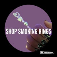 a person holding a smoking ring with the words shop smoking rings