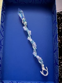 a blue box with a mermaid necklace in it