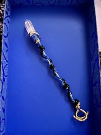 a blue box with a blue wand in it